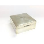 A silver cigarette box, approx width 8.5cm, Birmin