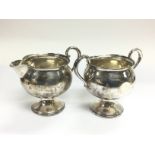 A silver jug and conforming sugar bowl. Shipping c