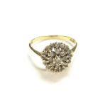 An 18ct gold diamond cluster ring. Size S and 3.78