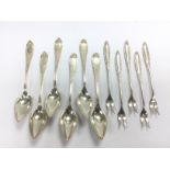Five silver pickle forks and six silver spoons. Sh