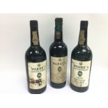 Three bottles of Warre's vintage port comprising a