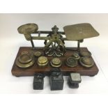 A set of antique brass postal scales and weights. Shipping category D.