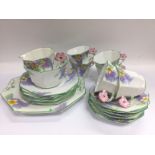 An Aynsley tea set in Lilac Time pattern. Shipping