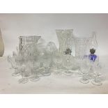 A large collection of cut glass including cups, vases, oil lamps etc. postage cat D some damage.