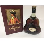 A bottle of Hennessy Cognac X.O boxed.