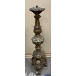 A carved and gilt wooden candlestick, 60cm. (D).