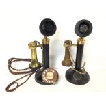 A pair of candlestick telephones, approximately 33