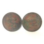 Two Indian brass shields. Approximate diameters of