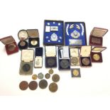 A collection of various medallions and medals including a Queen Mary 1911 coronation medal.