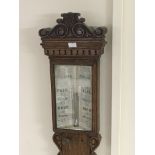 A quality oak late 19th Century stick barometer maker J W Wood of Manchester with a silvered dial