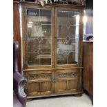 An oak glazed 2 door cabinet with lead glazed fron