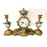 French gilded metal and porcelain clock garniture, circa 1885. (Clock 30cm).