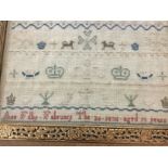 A framed Sampler dated 1830 32 cm by 22 cm.