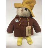 A Vintage Paddington Bear with yellow boots and ha