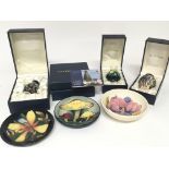 Three boxed small Moorcroft vases and three Moorcr