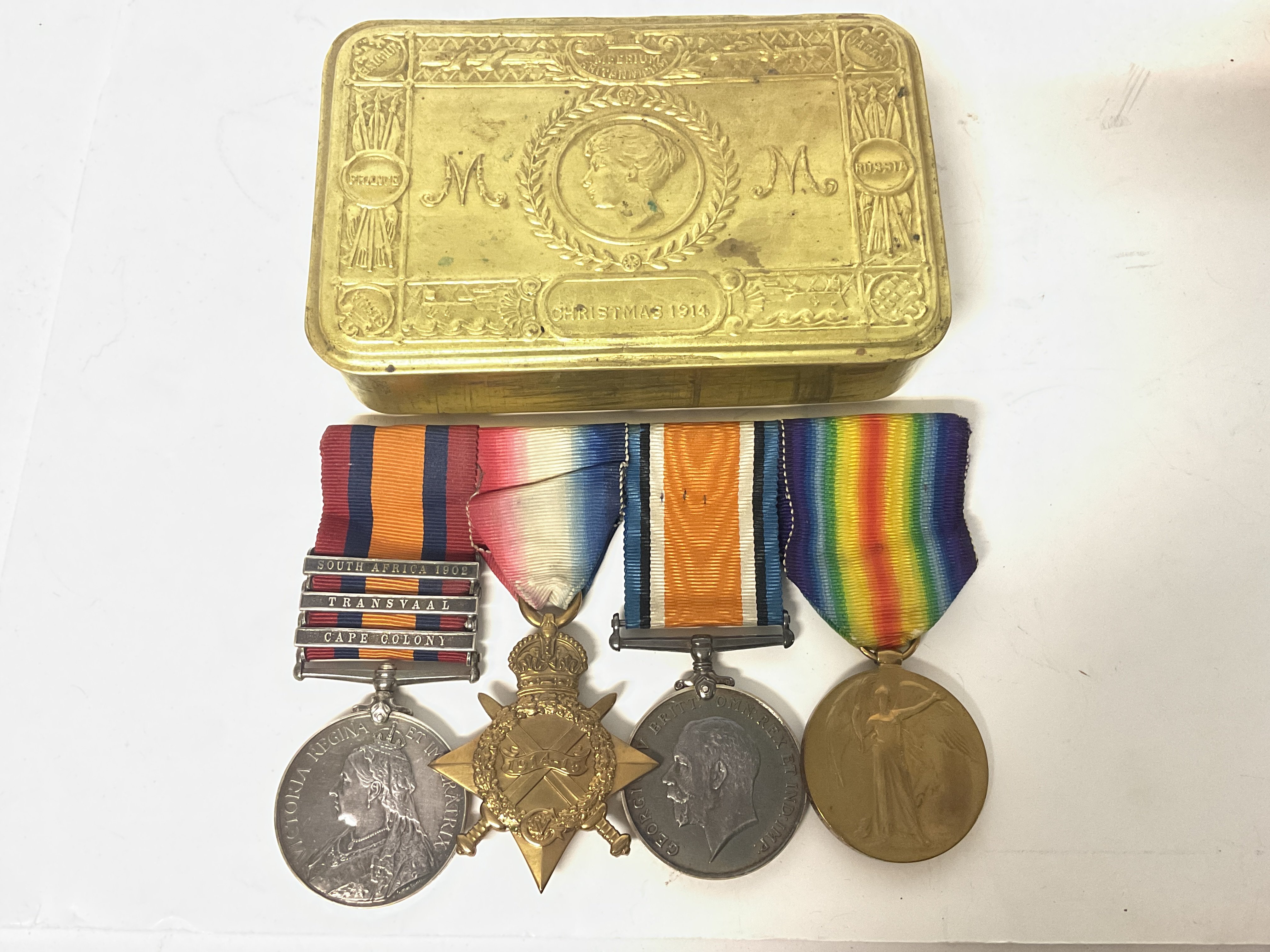 A collection of medals including a South African campaign medal with three clasps & three WW1 medals