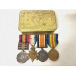 A collection of medals including a South African campaign medal with three clasps & three WW1 medals