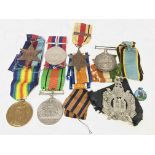 A collection of unmarked war medals including A North Africa Star 1942-1943 medal & a kings own