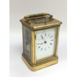 A brass cased striking carriage clock.