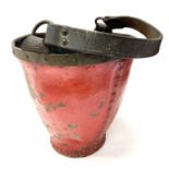 An Antique red leather fire bucket with hand painted Royal coat of arms, metal collar and stud work.