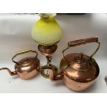 2 Victorian copper and brass kettles together with an arts and crafts brass and copper oil lamp.