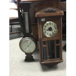 An oak wall clock with a visible pendulum and an o