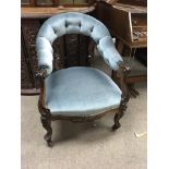A Victorian Rosewood open arm chair with scroll su