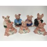 A collection of seven NatWest bank piggy money box