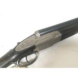 A 12bore double barrel side by side shot gun Maker Denton and Kennell with a nice engraved steel