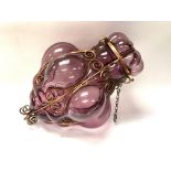 A 1970s Italian hand blown amethyst glass and metal worked hanging lamp. 39cm.