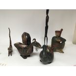 A collection of carved wood and painted figures in