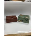 Two Rolex boxes with buckles on the top and a Role