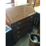 A George III mahogany bureau with a fall front abo