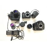 A collection of cameras and lenses. Postage C