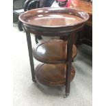 A Mahogany French Empire design three tier occasio