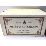 A box of unopened Moet champagne