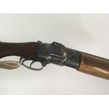 A 12bore over and under shot gun walnut stock with double trigger and ejector fixed choke R/H with a