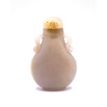 A carved pear shaped white agate snuff bottle with
