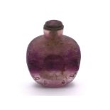 A carved amethyst rock crystal snuff bottle the de