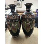 A pair of cloisonnÃ© vases decorated with birds fl