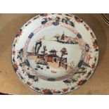 A Chinese Imari plate decorated with landscape vie