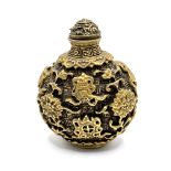 A cast gilt bronze snuff bottle with decoration in