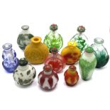 A collection of varied cameo glass snuff bottles.