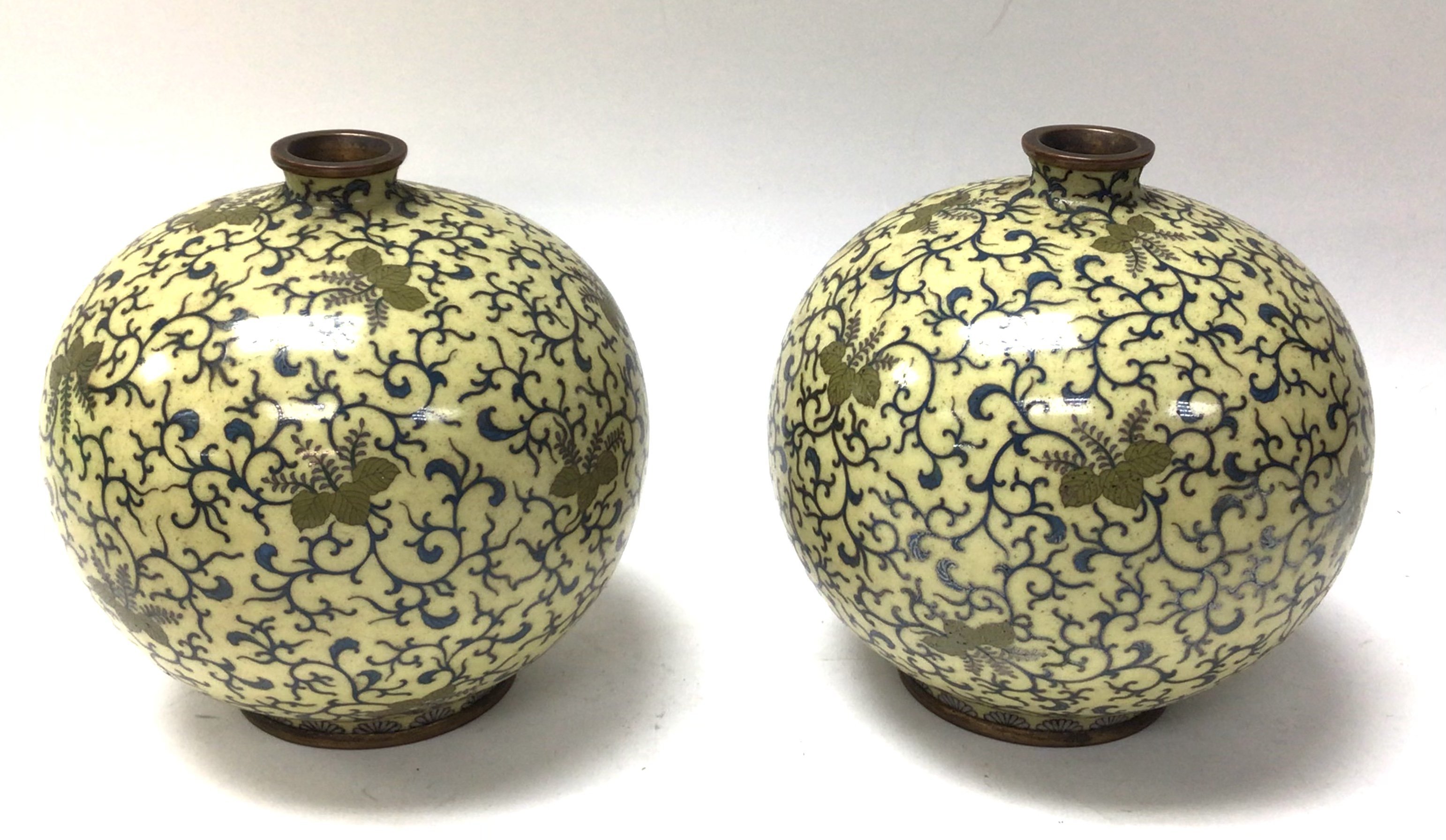 A pair of ovoid form cloisonne enamel decorated va