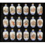 A cased set of 18 hand painted porcelain snuff bot