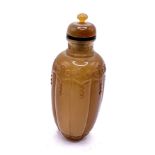 A finely carved polished agate snuff bottle with m