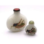 2 Milk glass snuff bottles both with hand painted