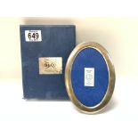 A boxed oval hallmarked silver photo frame, (B)