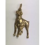 A 9ct gold pendant in the form of a dog 6 .4 grams