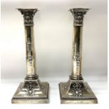 A pair of hallmarked silver Corinthian column cand